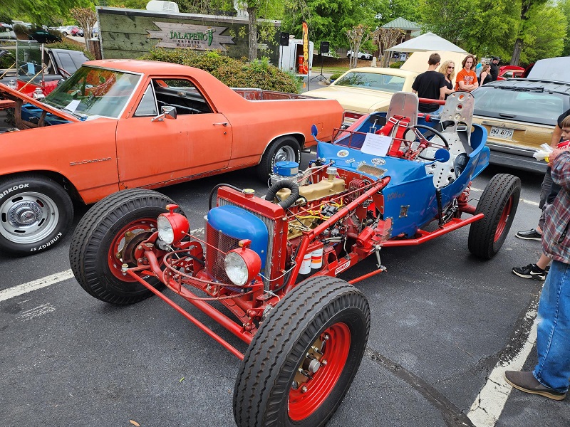 a truck is parked in front of a car